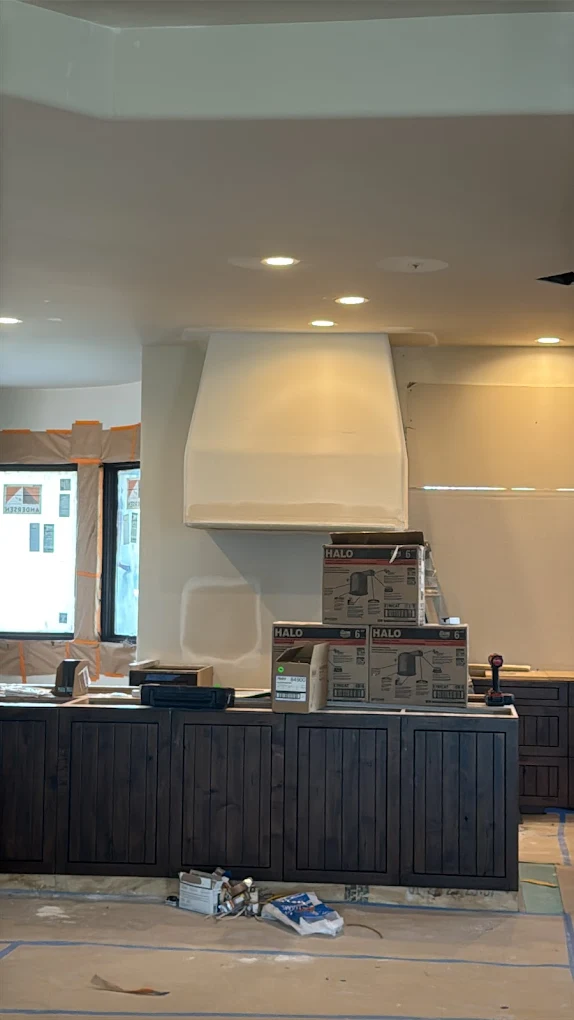 Finished kitchen with custom range hood
