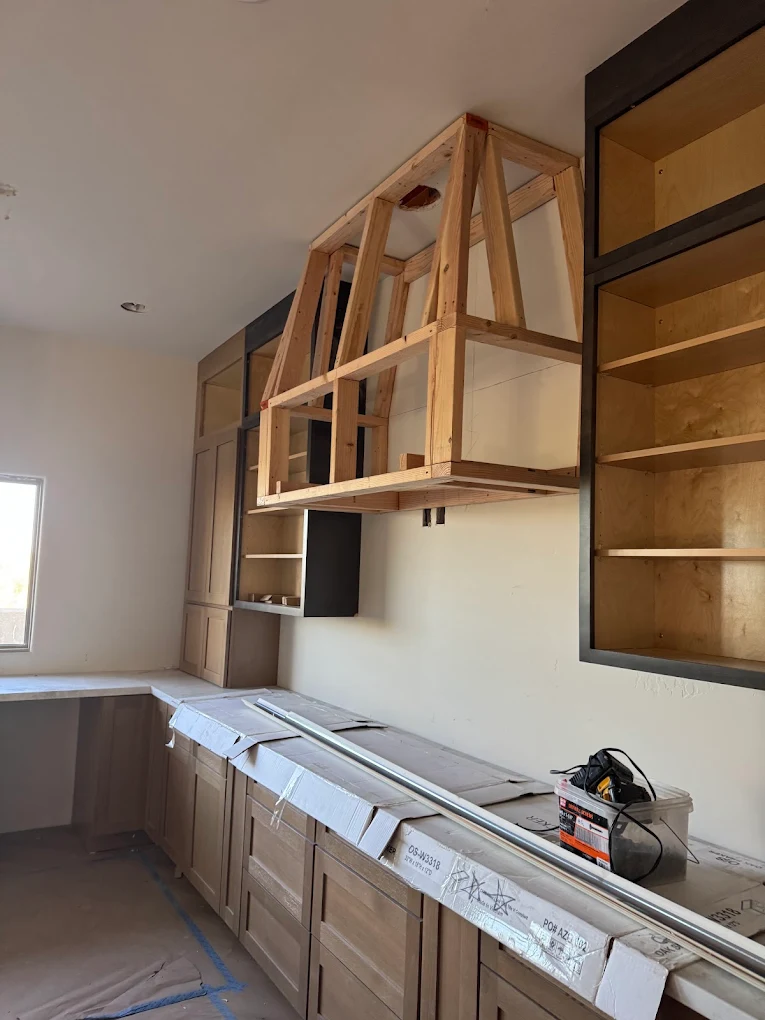 Custom range hood framing and finish work